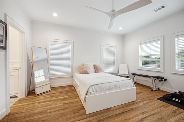 319 E 26th St, Houston, TX 77008 - bedroom featuring ornamental molding, light wood-type flooring, baseboards, recessed lighting, and ceiling fan