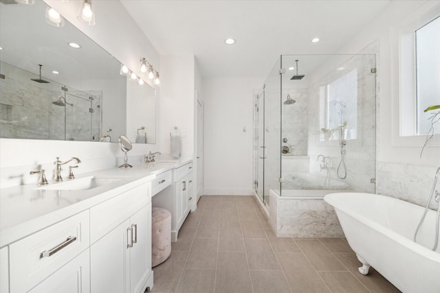 319 E 26th St, Houston, TX 77008 - full bath featuring a shower stall, recessed lighting, a freestanding bath, double vanity, and tile patterned floors