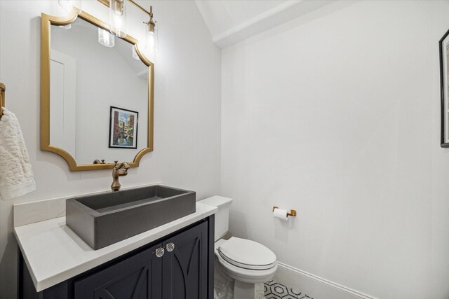 319 E 26th St, Houston, TX 77008 - bathroom with toilet, vanity, and baseboards