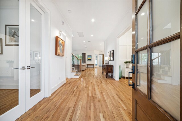319 E 26th St, Houston, TX 77008 - corridor with stairway, french doors, light wood-type flooring, recessed lighting, and baseboards