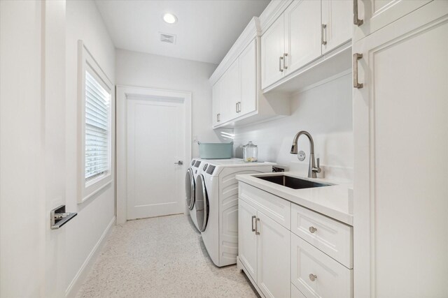 319 E 26th St, Houston, TX 77008 - washroom with separate washer and dryer, cabinet space, baseboards, and recessed lighting