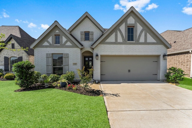 19419 Filly Chase Ct, Tomball, TX 77377 - view of front facade with a front yard, brick siding, driveway, and a garage