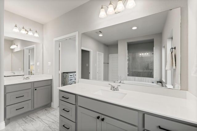 19419 Filly Chase Ct, Tomball, TX 77377 - bathroom featuring two vanities, marble look tiles, and recessed lighting