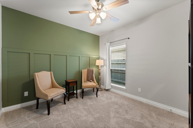 19419 Filly Chase Ct, Tomball, TX 77377 - sitting room with carpet flooring, a decorative wall, ceiling fan, and a wainscoted wall
