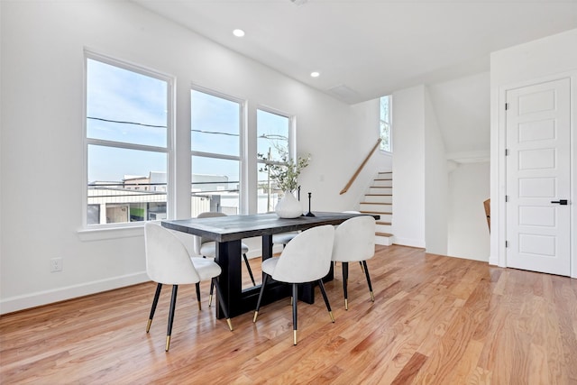 dining space with healthy amount of natural light, stairway, light wood-style floors, baseboards, and recessed lighting