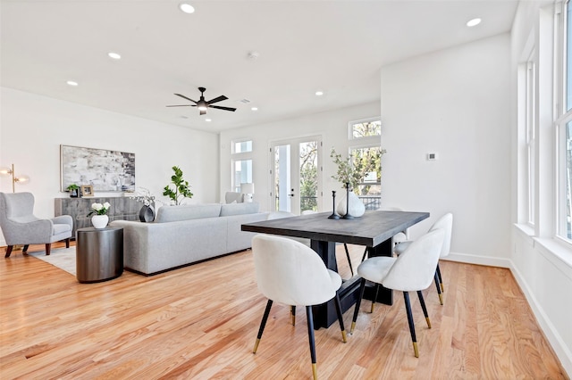 dining space featuring healthy amount of natural light, recessed lighting, light wood-style floors, ceiling fan, and baseboards