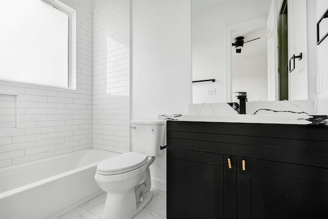 full bathroom with marble finish floors, toilet, vanity, and baseboards