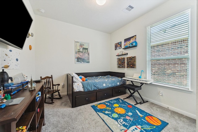 bedroom with carpet and baseboards