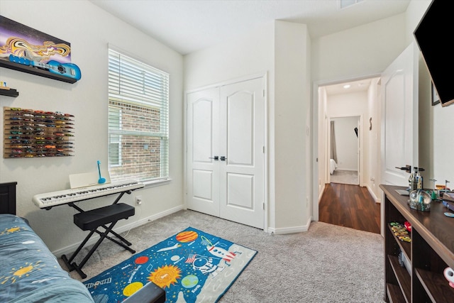 rec room with carpet floors and baseboards
