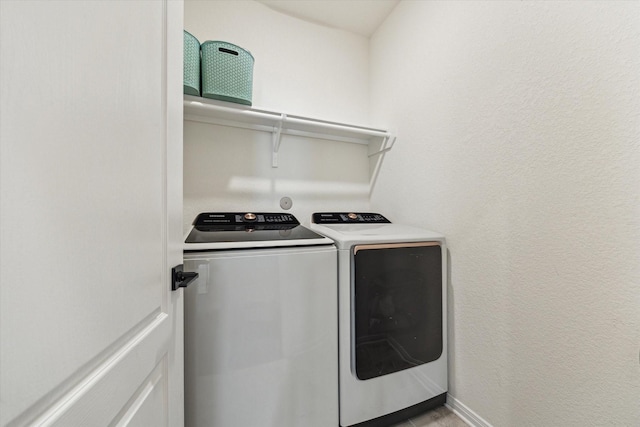washroom with washer and clothes dryer