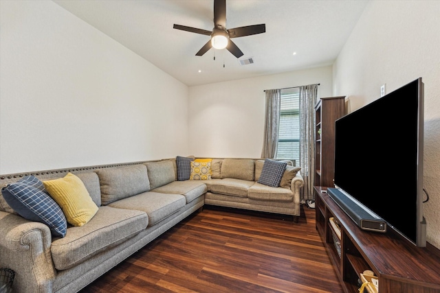 living area with wood finished floors and a ceiling fan