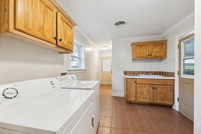 13016 W Burton St, Burton, TX 77835 - clothes washing area with ornamental molding, cabinet space, washer and dryer, dark tile patterned flooring, and baseboards
