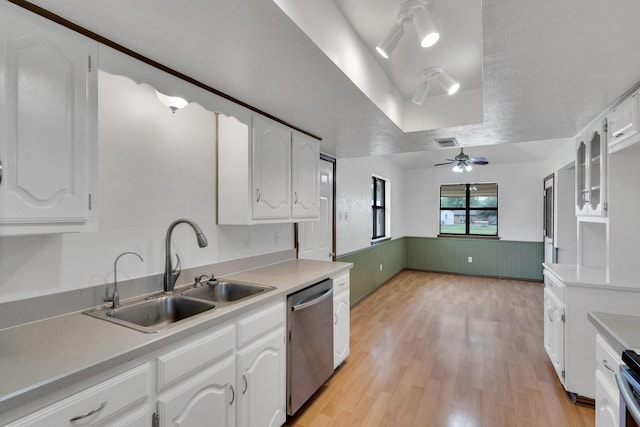 132 Prairie View Ln, Red Oak, TX 75154 - kitchen featuring dishwasher, a sink, a raised ceiling, white cabinetry, and light wood finished floors