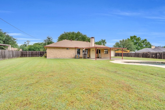 132 Prairie View Ln, Red Oak, TX 75154 - back of house with a patio area, a chimney, central air condition unit, brick siding, and an attached carport