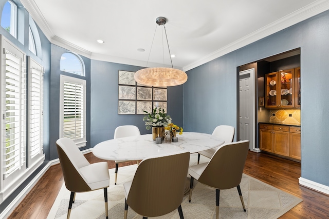 5206 Stamper Way, Houston, TX 77056 - dining area featuring ornamental molding, dark wood-type flooring, healthy amount of natural light, and baseboards