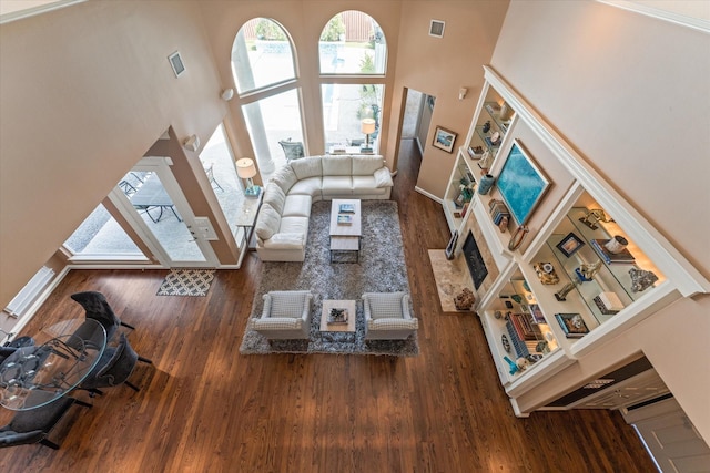 5206 Stamper Way, Houston, TX 77056 - living room featuring a high ceiling, wood finished floors, and baseboards