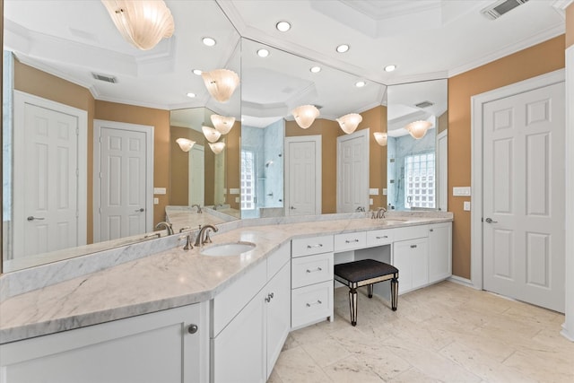 5206 Stamper Way, Houston, TX 77056 - bathroom featuring crown molding, double vanity, recessed lighting, and baseboards