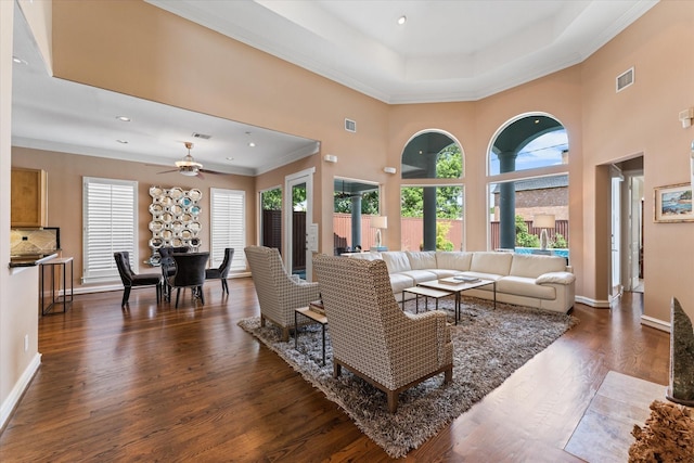 5206 Stamper Way, Houston, TX 77056 - living room featuring dark wood-style flooring, healthy amount of natural light, ceiling fan, crown molding, and baseboards