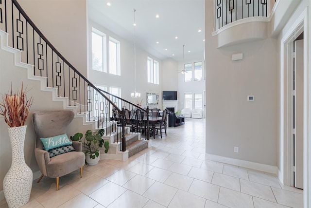 3514 Hampton Landing Ct, Katy, TX 77494 - tiled entrance foyer featuring a towering ceiling, stairway, plenty of natural light, recessed lighting, and a fireplace