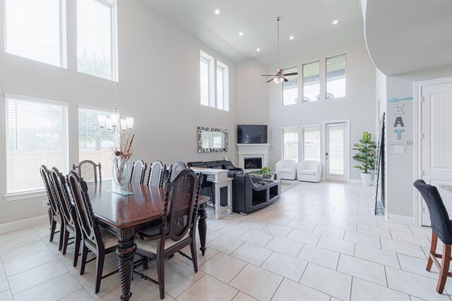 3514 Hampton Landing Ct, Katy, TX 77494 - dining area featuring a high ceiling, a chandelier, ceiling fan, baseboards, and recessed lighting