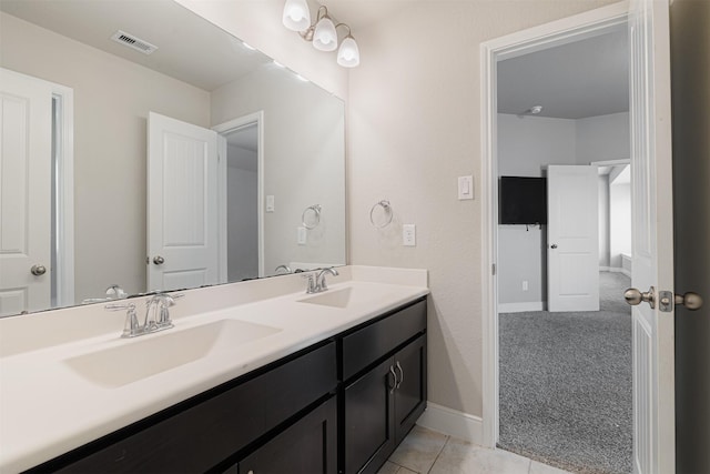 3514 Hampton Landing Ct, Katy, TX 77494 - bathroom featuring double vanity, baseboards, and tile patterned floors