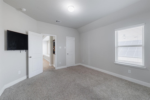 3514 Hampton Landing Ct, Katy, TX 77494 - unfurnished bedroom with carpet flooring, vaulted ceiling, and baseboards
