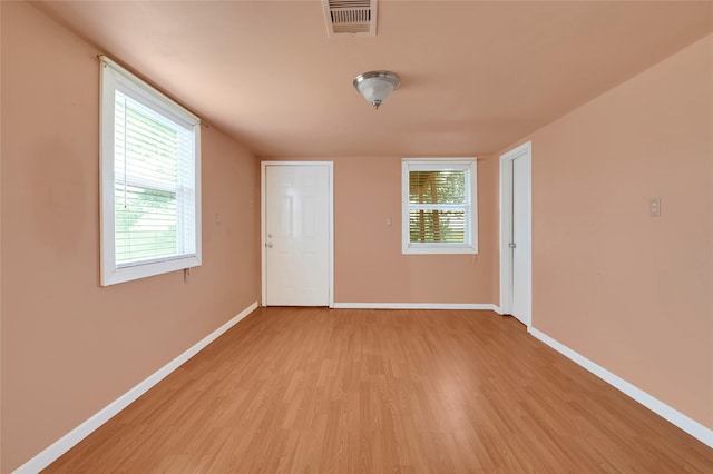 116 Linda St, Anahuac, TX 77514 - spare room with light wood finished floors and baseboards