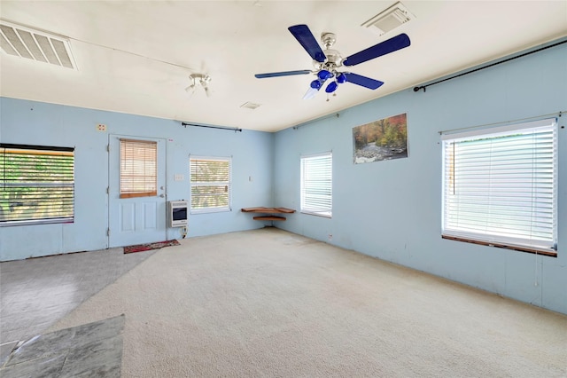116 Linda St, Anahuac, TX 77514 - carpeted empty room with a ceiling fan and heating unit