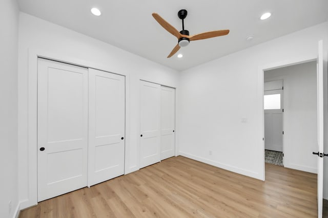 5520 Chapman St, Houston, TX 77009 - unfurnished bedroom with light wood-style floors, multiple closets, baseboards, recessed lighting, and a ceiling fan