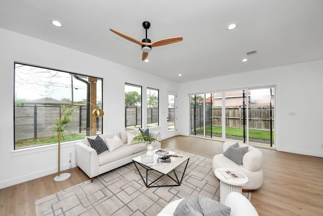 5520 Chapman St, Houston, TX 77009 - living room with light wood finished floors, baseboards, a ceiling fan, and recessed lighting