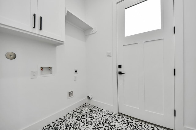 5520 Chapman St, Houston, TX 77009 - laundry area featuring cabinet space, hookup for an electric dryer, baseboards, hookup for a washing machine, and tile patterned floors