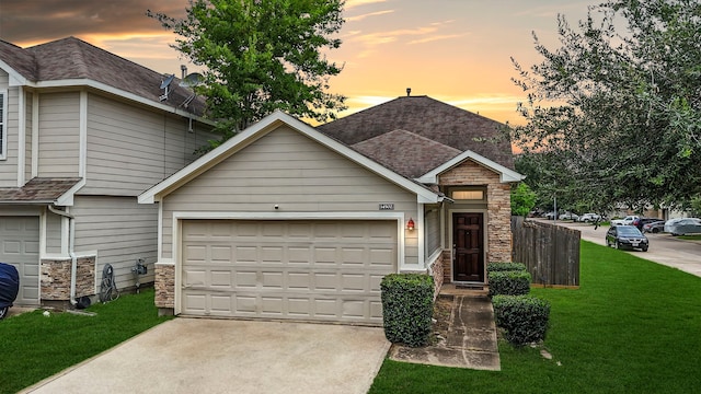 14502 Windmill Meadows Ct, Houston, TX 77082 - view of front of property featuring concrete driveway, a front yard, stone siding, an attached garage, and a shingled roof