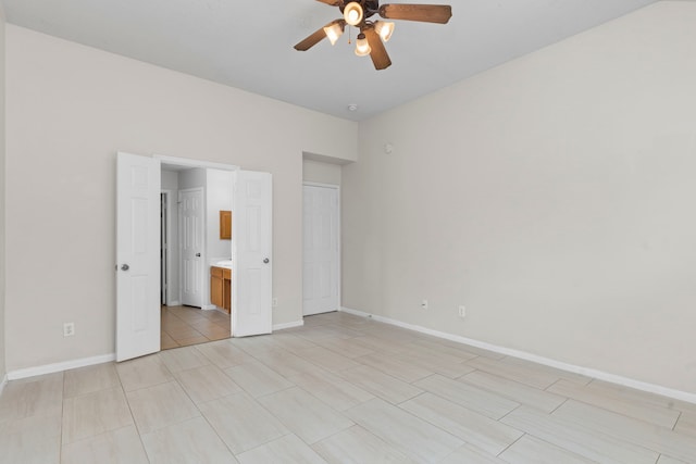 14502 Windmill Meadows Ct, Houston, TX 77082 - unfurnished bedroom with baseboards, connected bathroom, and a ceiling fan