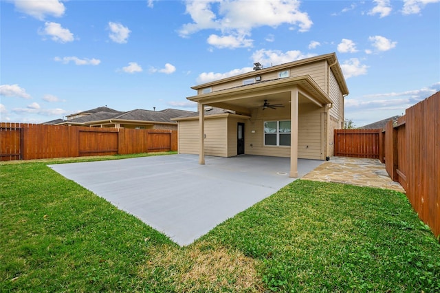 back of property featuring ceiling fan and a patio