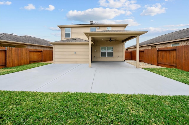 back of house with ceiling fan and a patio area