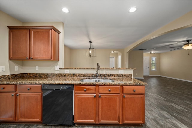 kitchen with dishwasher, a sink, open floor plan, a peninsula, and ceiling fan