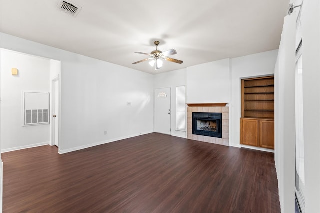 3500 Tangle Brush Dr Unit 193, The Woodlands, TX 77381 - unfurnished living room with ceiling fan, a fireplace, dark wood-style floors, and baseboards