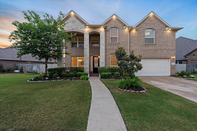 4603 Tamara Heights Ln, Sugar Land, TX 77479 - french country inspired facade featuring brick siding, a garage, and driveway
