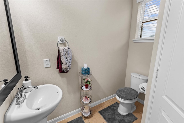 4603 Tamara Heights Ln, Sugar Land, TX 77479 - half bath with a sink, toilet, tile patterned flooring, and baseboards