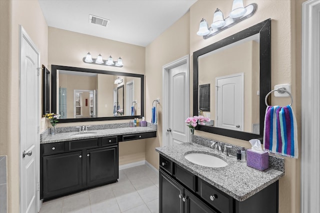 4603 Tamara Heights Ln, Sugar Land, TX 77479 - bathroom with tile patterned flooring, baseboards, and two vanities