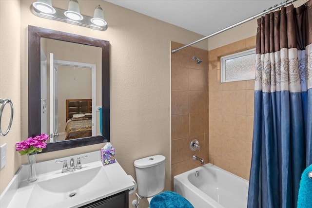4603 Tamara Heights Ln, Sugar Land, TX 77479 - bathroom with shower / tub combo, a textured wall, vanity, and toilet
