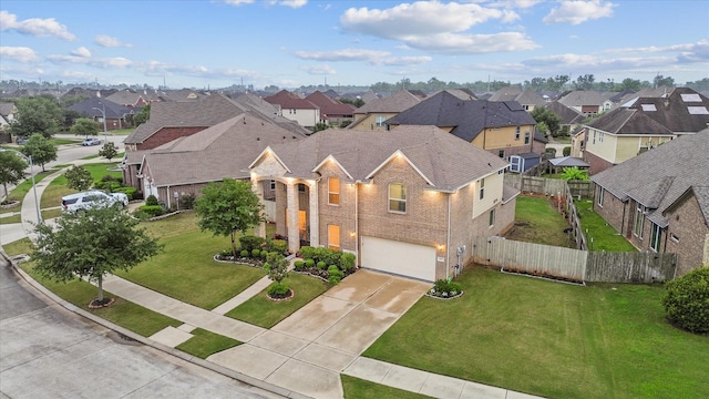 4603 Tamara Heights Ln, Sugar Land, TX 77479 - view of front of property featuring a residential view, driveway, a garage, brick siding, and roof with shingles