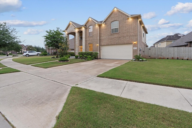 4603 Tamara Heights Ln, Sugar Land, TX 77479 - view of front of house with brick siding, an attached garage, and driveway