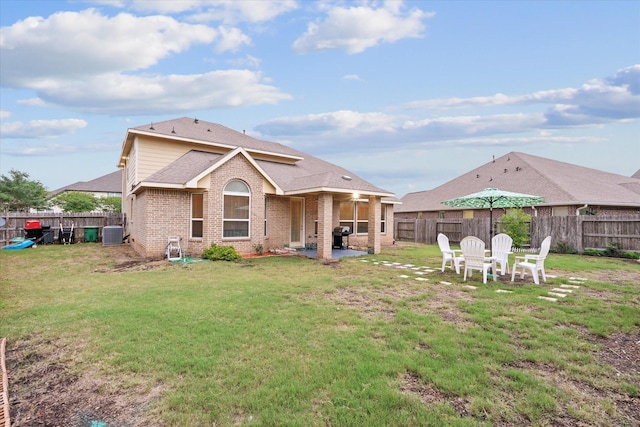 4603 Tamara Heights Ln, Sugar Land, TX 77479 - back of house featuring a patio, central AC unit, brick siding, and a shingled roof