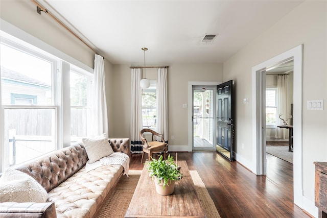 108 E 27th St, Houston, TX 77008 - living room with dark wood-style floors, healthy amount of natural light, and baseboards