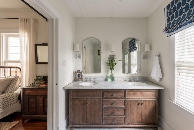 108 E 27th St, Houston, TX 77008 - full bathroom with double vanity and wood finished floors