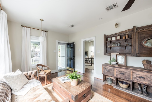 108 E 27th St, Houston, TX 77008 - living room featuring wood finished floors and baseboards