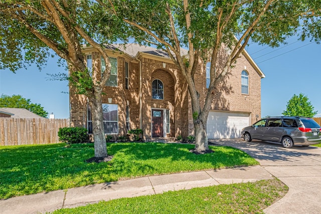 2202 Megellan Point Ln, Pearland, TX 77584 - traditional-style home with brick siding, asphalt driveway, and an attached garage