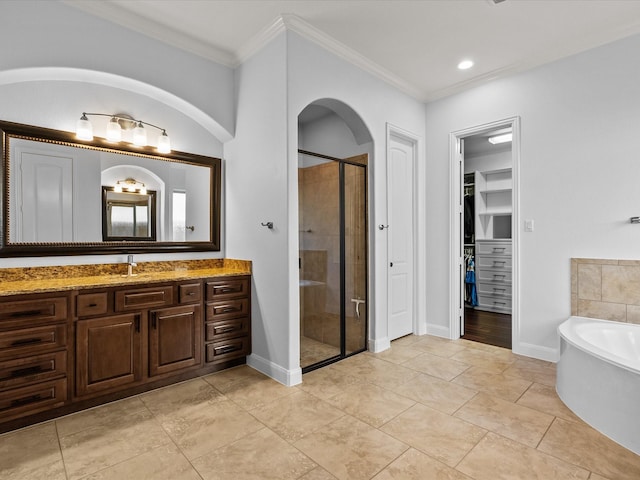 913 Ember Hills Ln, Friendswood, TX 77546 - bathroom with ornamental molding, a shower stall, vanity, a bath, and baseboards