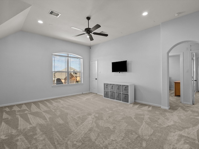913 Ember Hills Ln, Friendswood, TX 77546 - unfurnished living room featuring light carpet, a ceiling fan, arched walkways, baseboards, and recessed lighting